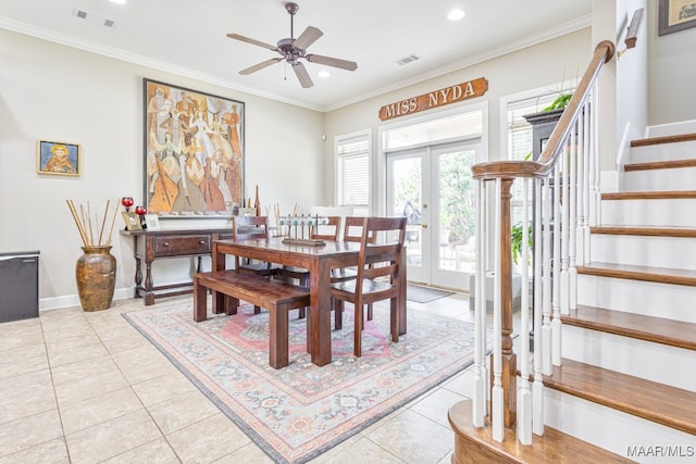 dining space featuring french doors, ceiling fan, ornamental molding, and light tile patterned floors