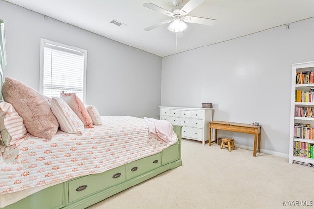 carpeted bedroom featuring ceiling fan