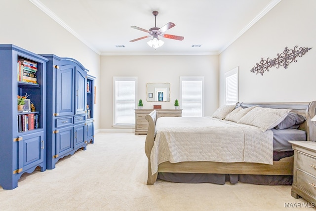 carpeted bedroom featuring crown molding, multiple windows, and ceiling fan