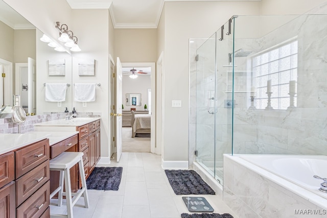 bathroom featuring vanity, separate shower and tub, crown molding, and tile patterned floors