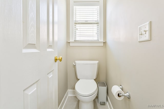 bathroom featuring toilet and tile patterned floors