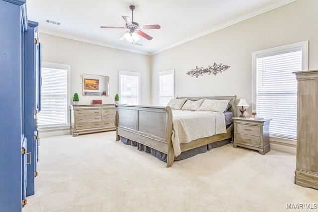 carpeted bedroom with multiple windows, crown molding, and ceiling fan