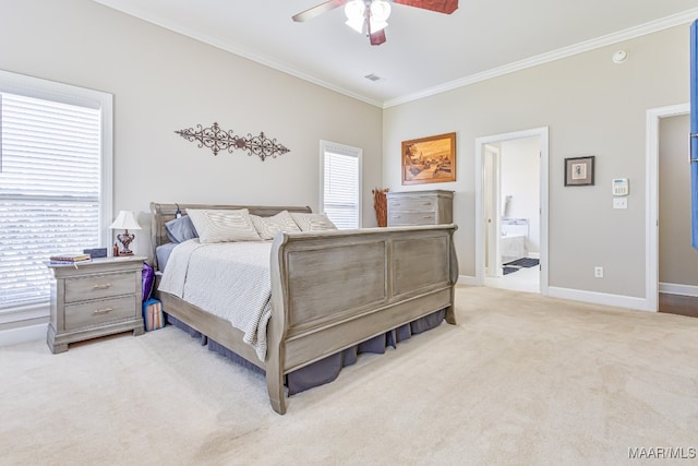 carpeted bedroom with ensuite bath, crown molding, and ceiling fan