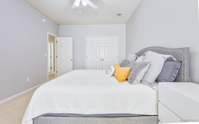 carpeted bedroom with a closet and ceiling fan