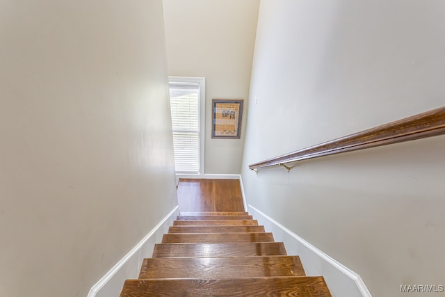 stairway featuring hardwood / wood-style flooring