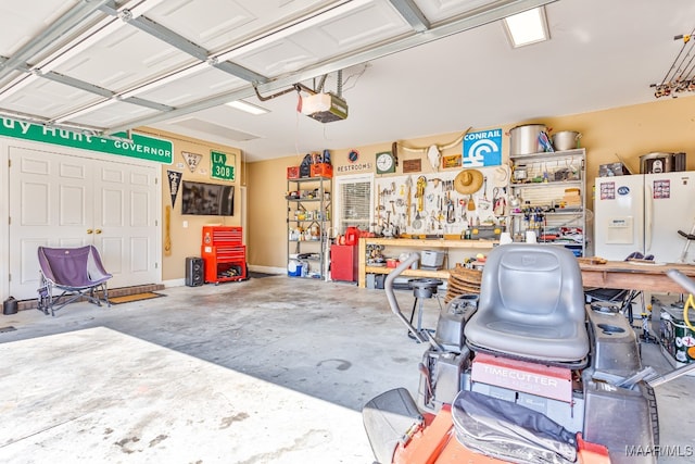 garage featuring a garage door opener, a workshop area, and white refrigerator with ice dispenser