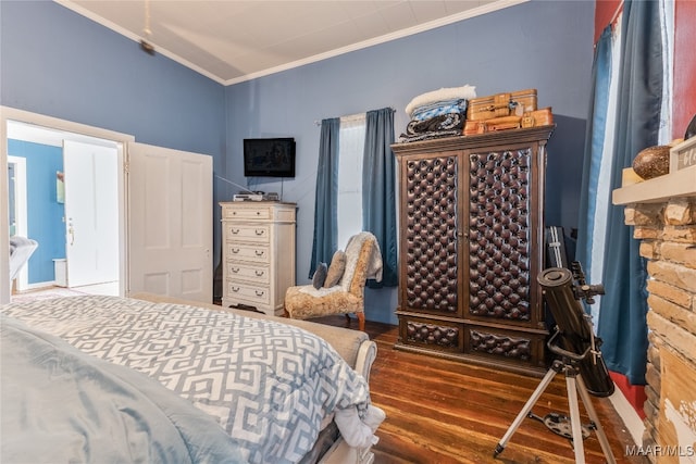 bedroom with dark wood-type flooring and crown molding