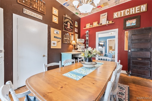 dining area with wood-type flooring