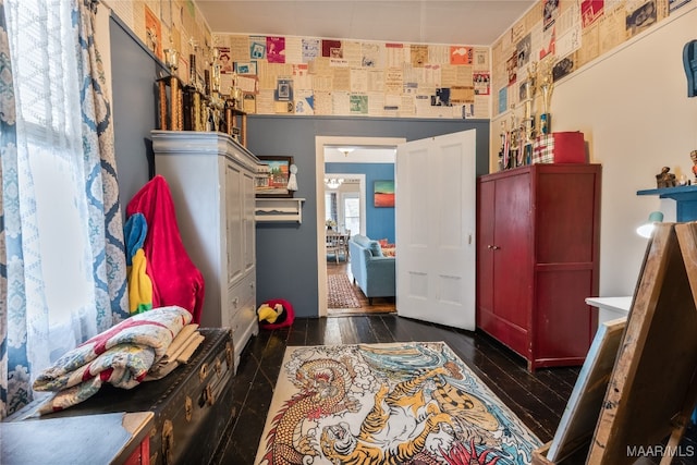 bedroom with dark wood-type flooring