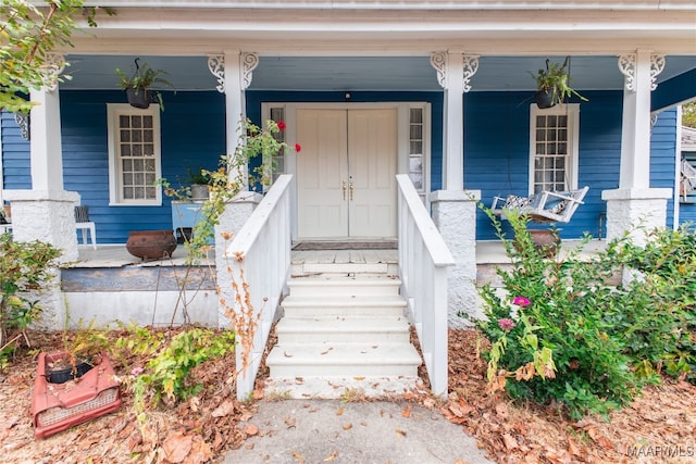 property entrance featuring covered porch