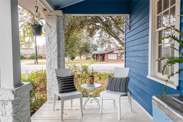 view of patio featuring a porch