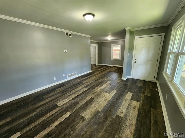 unfurnished room with ornamental molding and dark hardwood / wood-style floors