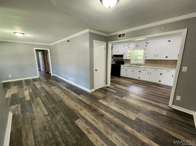 kitchen featuring white cabinets, ornamental molding, dark hardwood / wood-style floors, black range oven, and sink