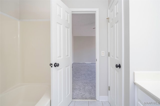 bathroom with vanity, shower / tub combination, and tile patterned floors