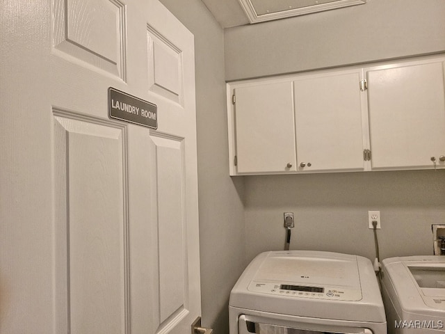 laundry area with cabinets and separate washer and dryer