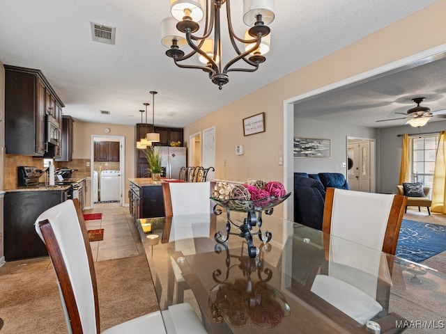 dining area with a textured ceiling, ceiling fan, and light carpet