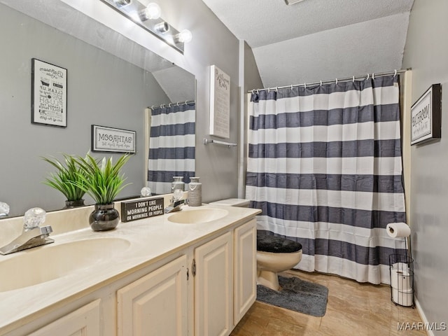 bathroom with a shower with curtain, lofted ceiling, a textured ceiling, toilet, and vanity