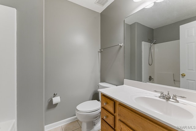 full bathroom featuring vanity, tub / shower combination, toilet, and tile patterned floors