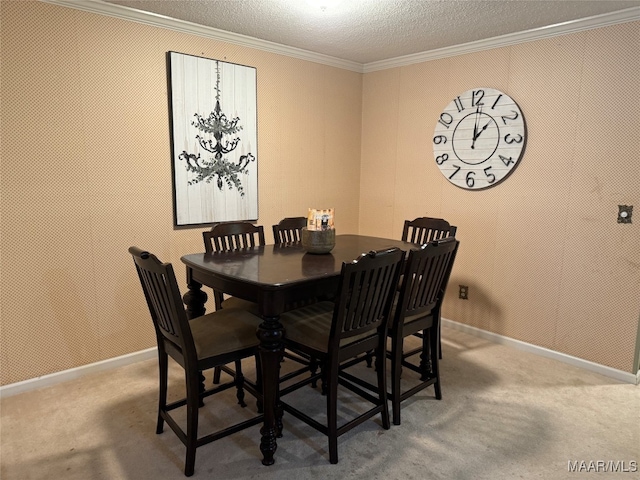 dining room featuring ornamental molding, a textured ceiling, and carpet flooring