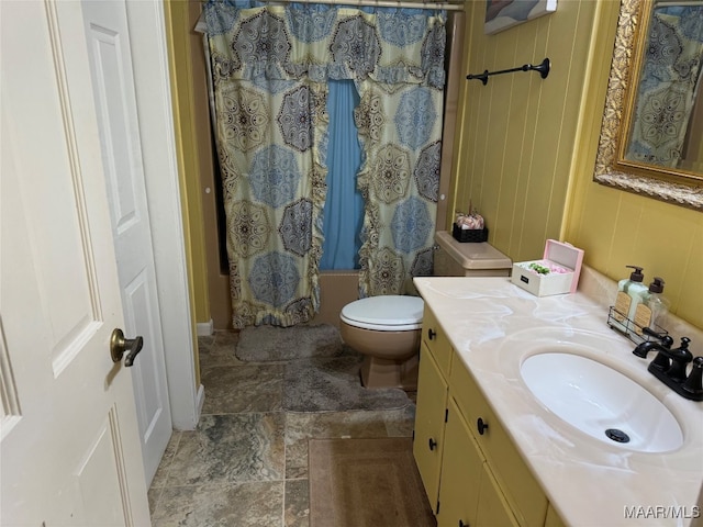 full bathroom featuring vanity, shower / bath combination with curtain, and toilet