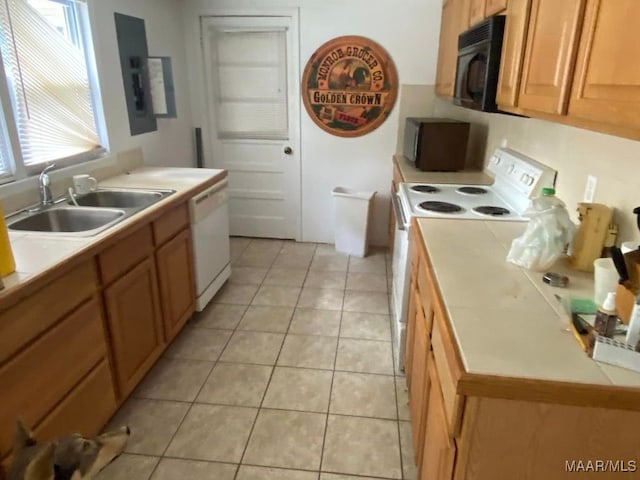 kitchen featuring white appliances, a sink, light tile patterned flooring, tile countertops, and electric panel