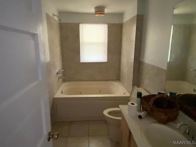 bathroom featuring tile patterned flooring, toilet, vanity, and shower / bathtub combination