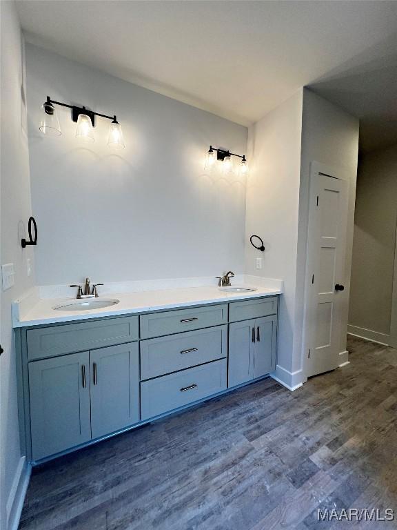 bathroom featuring vanity and hardwood / wood-style flooring