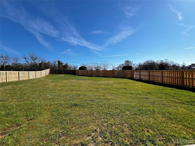 view of yard featuring a fenced backyard