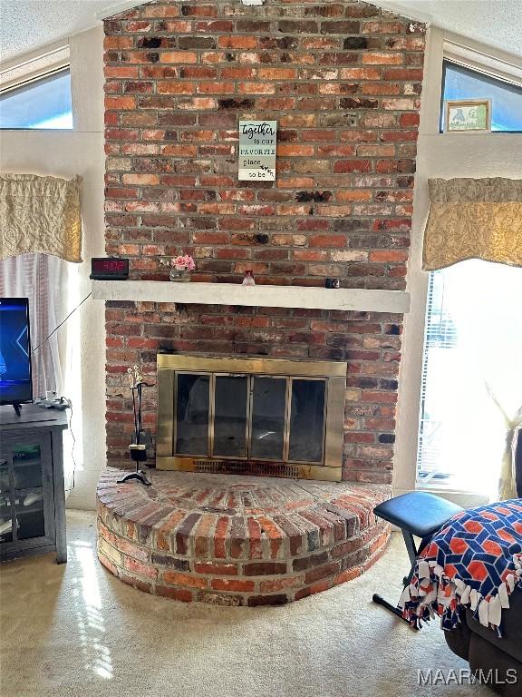 room details featuring a fireplace and a textured ceiling