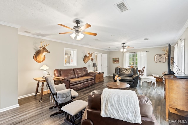 living room with dark wood-type flooring, crown molding, a textured ceiling, and ceiling fan