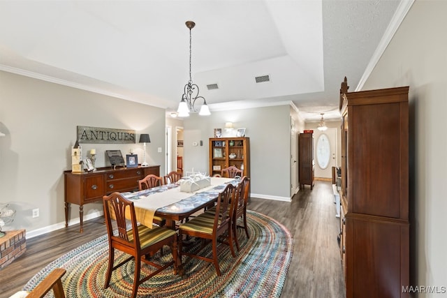 dining room featuring crown molding and dark wood-type flooring