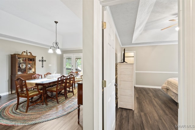 dining area with ornamental molding, a textured ceiling, dark hardwood / wood-style floors, and ceiling fan with notable chandelier