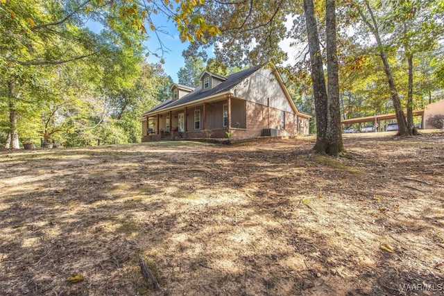 view of property exterior with a porch