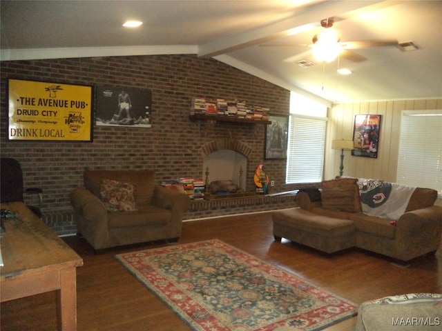 living room with brick wall, vaulted ceiling with beams, and hardwood / wood-style flooring