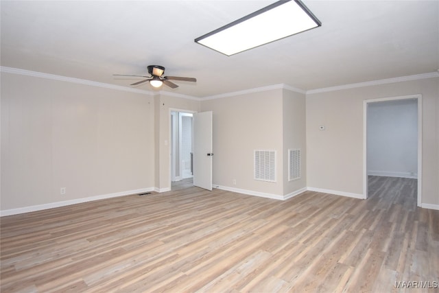 empty room featuring crown molding, light wood-type flooring, and ceiling fan