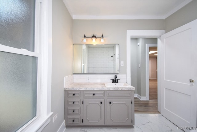 bathroom featuring vanity, crown molding, hardwood / wood-style flooring, and tiled shower