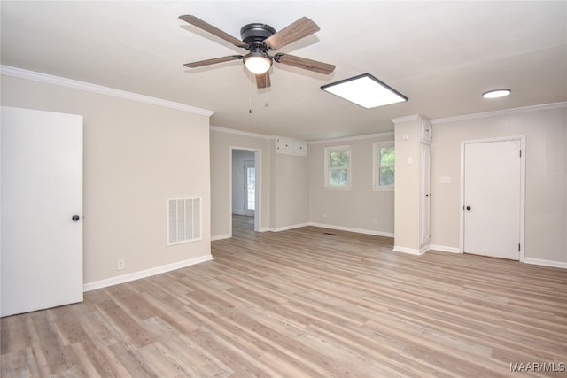 unfurnished room featuring light hardwood / wood-style floors, crown molding, and ceiling fan