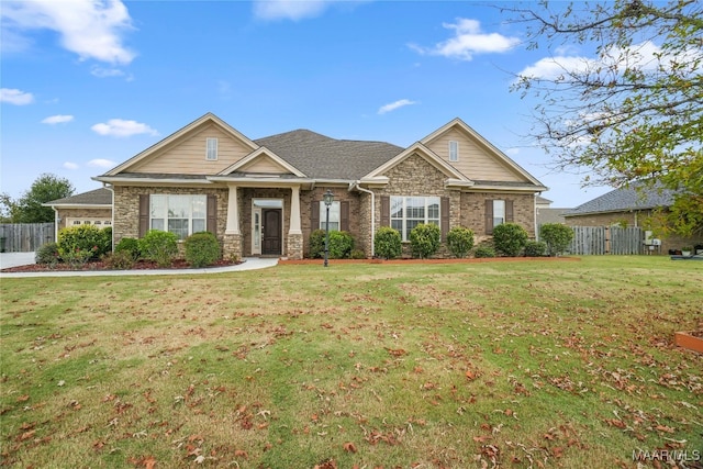 craftsman-style home with a front lawn