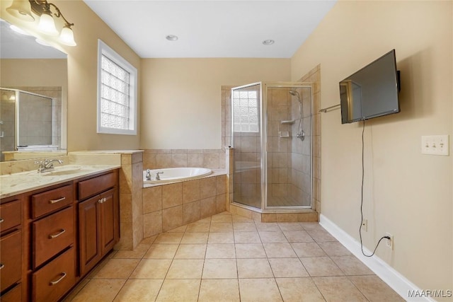 full bathroom featuring a shower stall, tile patterned floors, a bath, and vanity