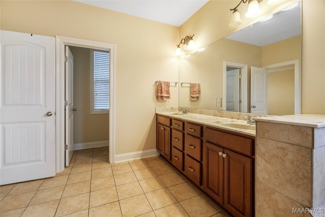 bathroom with tile patterned floors and vanity