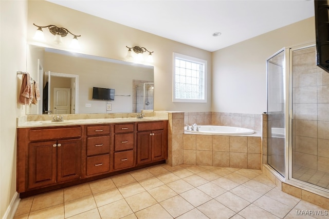 bathroom with separate shower and tub, vanity, and tile patterned flooring