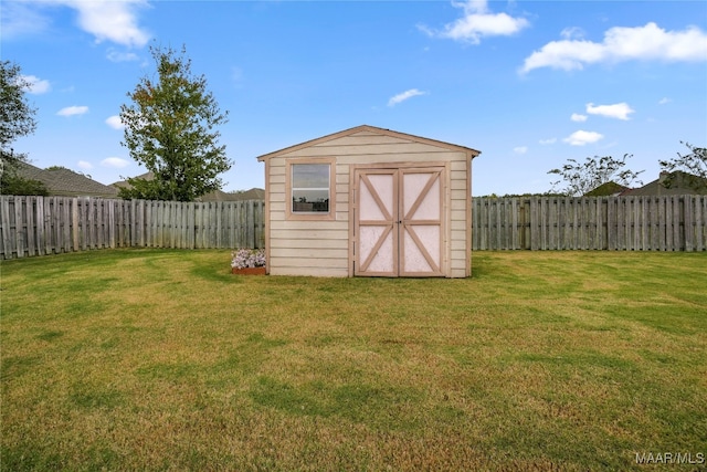 view of outdoor structure with a yard