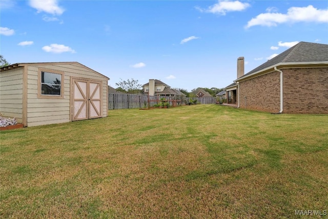 view of yard featuring a storage shed and an outdoor structure