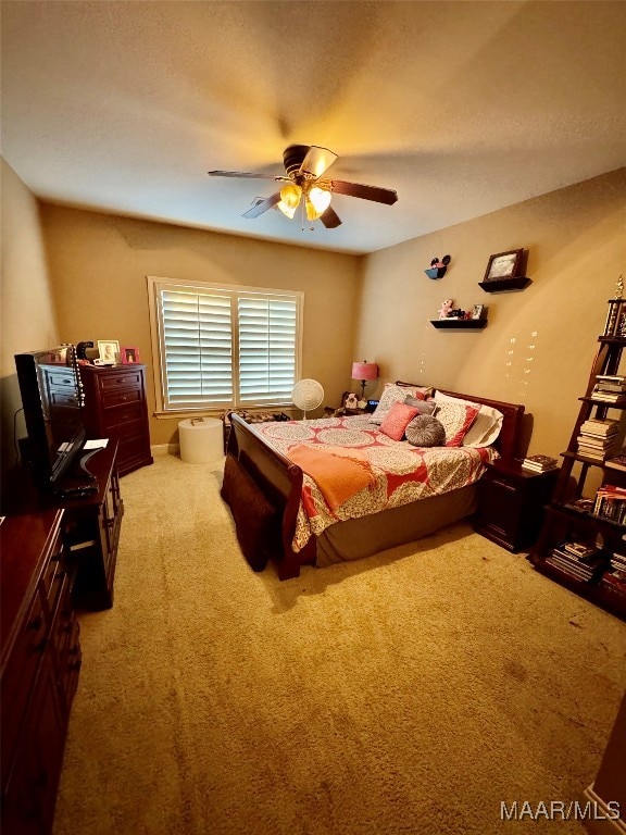 bedroom with light colored carpet and ceiling fan