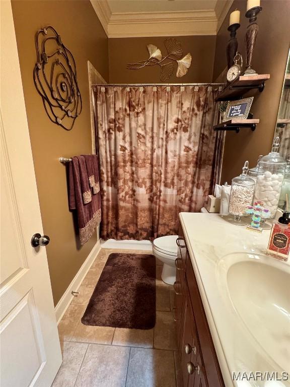 1160 Laurel Brook Ln, Montgomery, AL 36117 - bathroom with ornamental molding, vanity, tile patterned flooring, toilet, and a shower with curtain