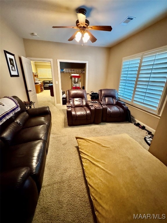 interior space with ceiling fan