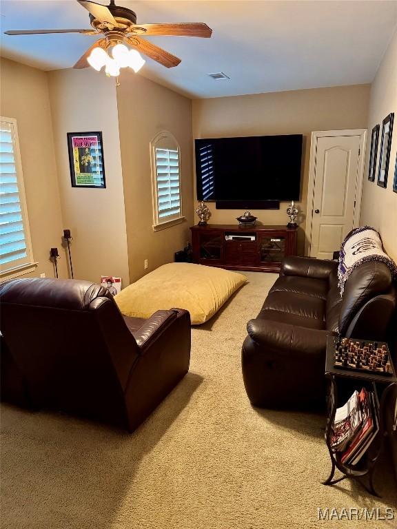 1160 Laurel Brook Ln, Montgomery, AL 36117 - living area featuring carpet floors, a ceiling fan, and healthy amount of natural light