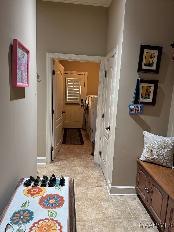 hallway with washer and clothes dryer