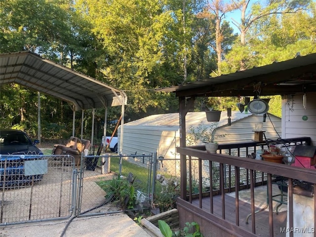 wooden terrace featuring fence and a gate