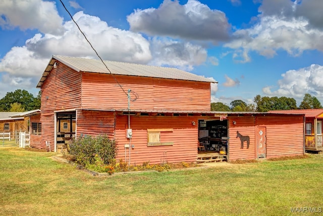 view of side of home featuring a lawn